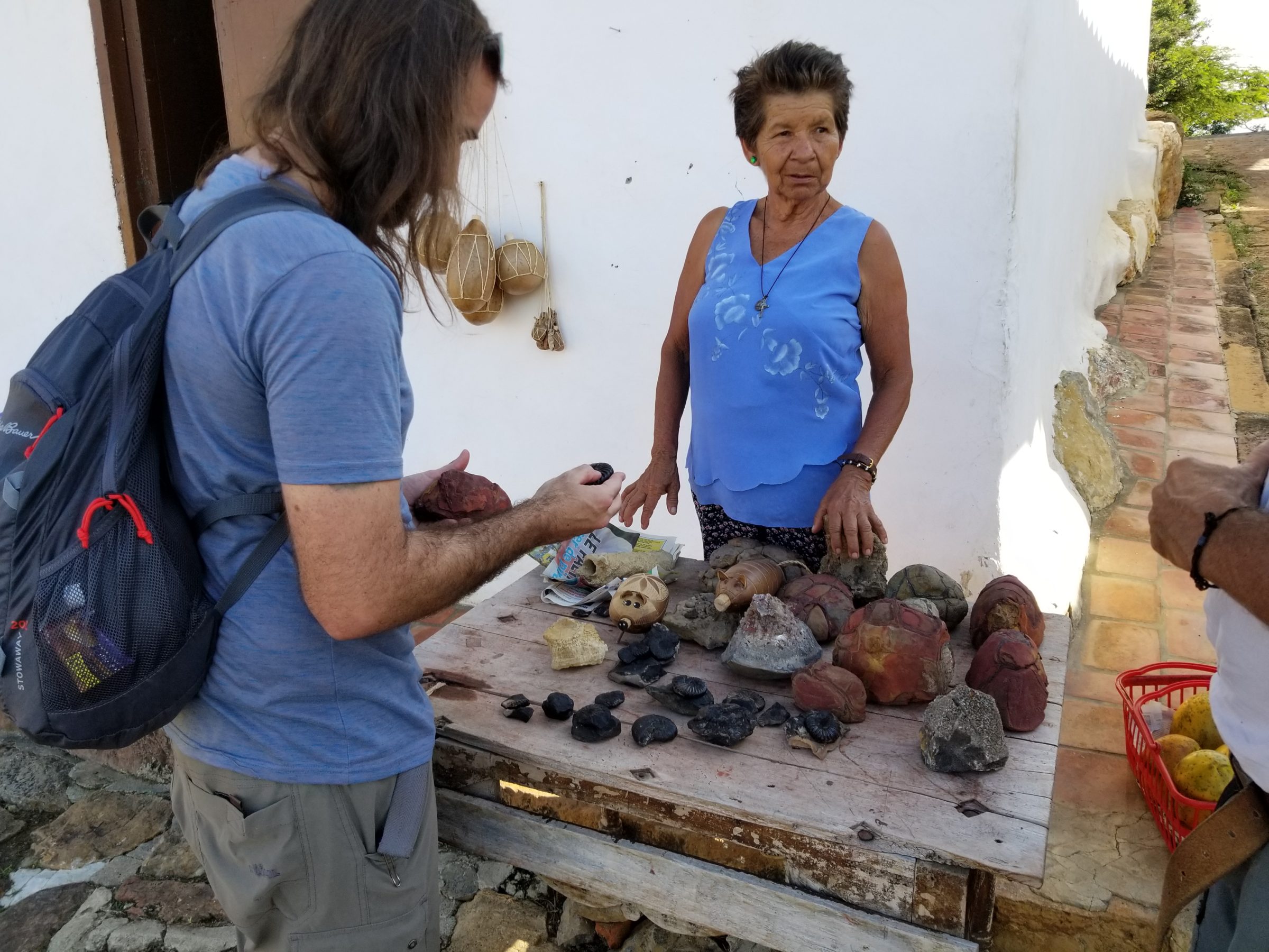 Jimmy fossil-shopping from a local in Guane